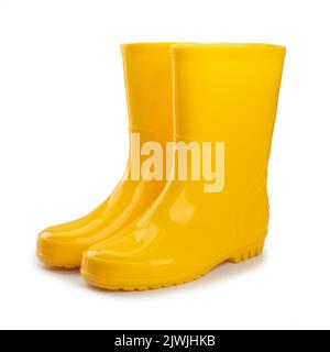 bottes en caoutchouc jaune isolées sur fond blanc Banque D'Images