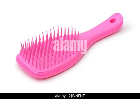 Brosse à cheveux en plastique rose avec poils en silicone doux isolés sur du blanc Banque D'Images