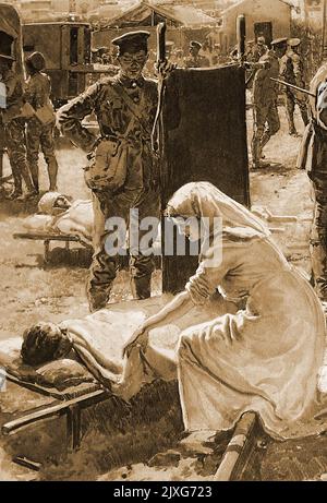 WWI France - Une infirmière britannique s'occupe d'un soldat blessé sur une civière, tandis qu'une civière porte une montre. Banque D'Images