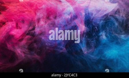 encre dans l'eau fond coloré bleu violet rose Banque D'Images