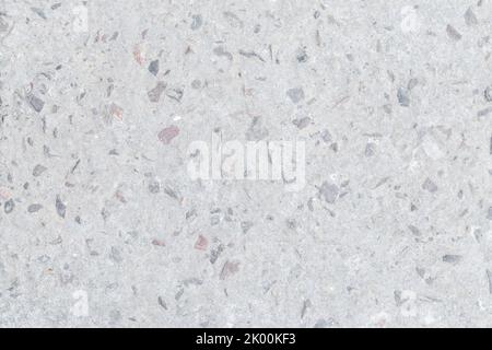 Texture de mur en granit gris, fond de roche blanc, motif de surface en marbre, petites pierres. Grès léger, matériau rugueux. Grafter le sol en béton, design Banque D'Images