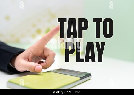 Texte montrant l'inspiration appuyez pour jouer. Concept signification touchez l'écran pour commencer à jouer à un jeu ou à autre chose Banque D'Images