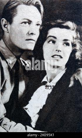 Richard Cromwell et Marsha Hunt dans le film de 1938 venez, Leathernecks! Est un film d'action américain de 1938. Richard Cromwell (né LeRoy Melvin Radabaugh, également connu sous le nom de Roy Radabaugh; 8 janvier 1910 - 11 octobre 1960) était un acteur américain. Marsha Hunt (née Marcia Virginia Hunt, 17 octobre 1917) est une actrice, mannequin et militante américaine, dont la carrière s'étend sur plus de 75 ans. Banque D'Images