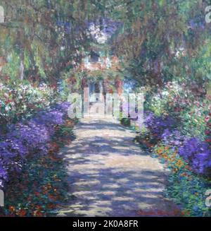 Chemin dans le jardin de Monet à Giverny, 1902. Oscar-Claude Monet (14 novembre 1840 - 5 décembre 1926) est un peintre français et fondateur de la peinture impressionniste qui est considéré comme un précurseur clé du modernisme, en particulier dans ses tentatives de peindre la nature telle qu'il l'a perçue. Banque D'Images