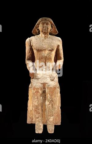 Figure en bois d'un noble du règne de Toutankhamon, un ancien pharaon égyptien qui était le dernier de sa famille royale à régner à la fin de la dynastie de 18th (régné c. 1332 - 1323 av. J.-C. dans la chronologie conventionnelle) pendant le Nouveau Royaume de l'histoire égyptienne Banque D'Images