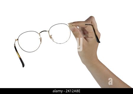 une paire de lunettes dans la main femelle sur fond blanc Banque D'Images