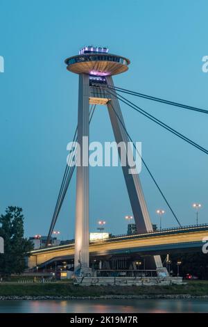 Bratislava, Slovakia - May 31, 2022: Night view on UFO observation desk of new bridge (Most SNP) over Danube river in Bratislava. Stock Photo