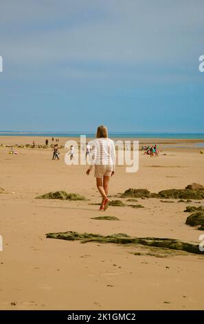 The lady on the beach at Barneville-Carteret, Cotentin Peninsula, Normandy, France, Europe Stock Photo