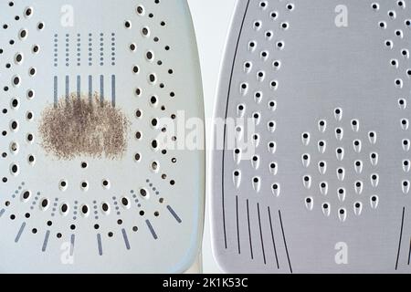 Fer ancien avec semelle endommagée et nouveau fer moderne sur fond blanc, entretien et entretien des appareils ménagers modernes Banque D'Images