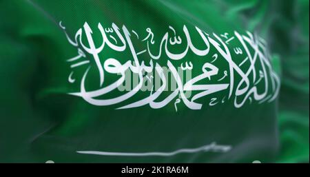 Vue rapprochée du drapeau national de l'Arabie saoudite qui agite dans le vent. Le Royaume d'Arabie saoudite (KSA) est un pays de la péninsule arabique, dans l'ouest de l'ASI Banque D'Images