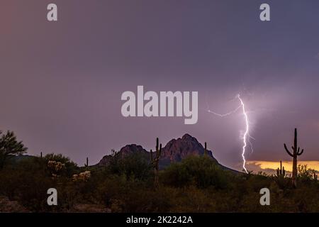 Sunset lightning over sonoran desert mountains Stock Photo