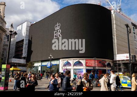 The State Funeral of Her Majesty Queen Elizabeth II, Advertising screens at Piccadilly Circus were all turned black and displayed the late queen's cyp Stock Photo