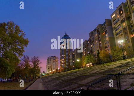 Night view of modern buildings in the Obolon district of Kiev, Ukraine, close to the Dnieper River Stock Photo