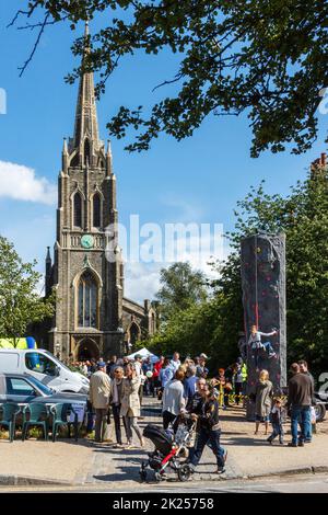 A climbing wall in the grounds of St Michael's Church during the Fair in the Square, an annual event in Highgate Village, London, UK Stock Photo