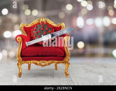 Fauteuil de luxe avec une seringue avec le vaccin de Covid-19 Banque D'Images