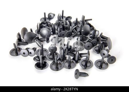 Black clips. Car spare parts isolated on white. Stock Photo