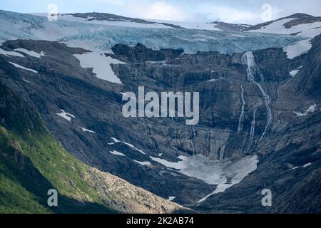 Wonderful landscapes in Norway. Nordland. Beautiful scenery of Svartisen glacier. Engabreen from the Holandsfjorden view. Mountains, trees, rocks and Stock Photo