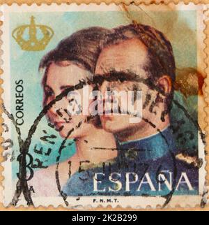 Photo of 3 pesetas Spanish postage stamp featuring an image of King Juan Carlos I Queen Sofía from 1975 the year of his proclamation as king of Spain Stock Photo