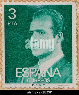 Photo of a green 3 pesetas Spanish postage stamp featuring an image of King Juan Carlos I Stock Photo