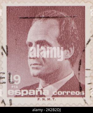 Photo of a brown 19 pesetas Spanish postage stamp featuring an image of King Juan Carlos I Stock Photo