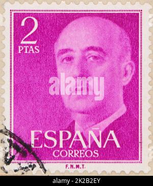 Photo of a fuchsia 2 pesetas Spanish postage stamp featuring an image of Francisco Franco Bahamonde from 1955 Stock Photo