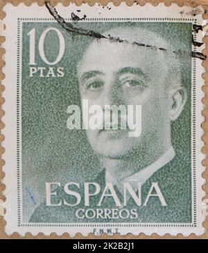 Photo of a green 10 pesetas Spanish postage stamp featuring an image of Francisco Franco Bahamonde from 1955 Stock Photo