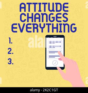 L'affiche textuelle montrant l'attitude change tout. Idée d'entreprise comportement positif atteindre l'objectif d'entreprise Illustration de la main à l'aide de Smart Phone SMS nouveaux messages importants. Banque D'Images