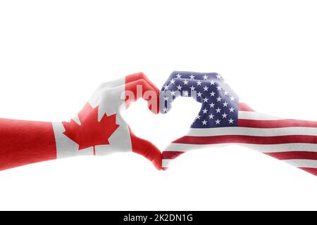 Deux mains en forme de coeur avec drapeau américain et canadien isolé sur fond blanc avec masque Banque D'Images