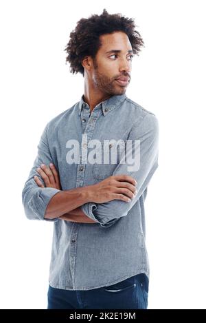 Cool, calm and collected. a handsome man with his arms crossed in studio isolated on white. Stock Photo