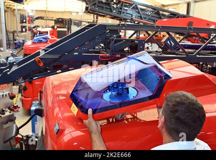 Karlsruhe, Germany. 19th July, 2022. A blue light is put on a fire truck at the Competence Center Aerial Rescue of the fire equipment manufacturer Rosenbauer. The Austrian company Rosenbauer is one of the world's largest manufacturers of fire fighting vehicles. Credit: Uli Deck/dpa/Alamy Live News Stock Photo