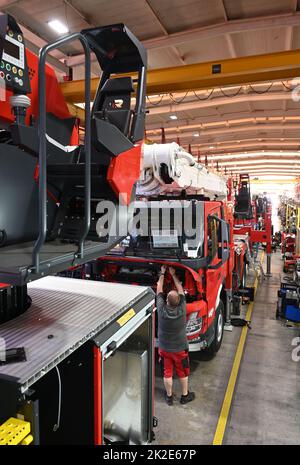 Karlsruhe, Germany. 19th July, 2022. At the Competence Center Aerial Rescue of the fire equipment manufacturer Rosenbauer, firefighting vehicles stand in an assembly hall during body construction. The Austrian company Rosenbauer is one of the world's largest manufacturers of fire fighting vehicles. Credit: Uli Deck/dpa/Alamy Live News Stock Photo