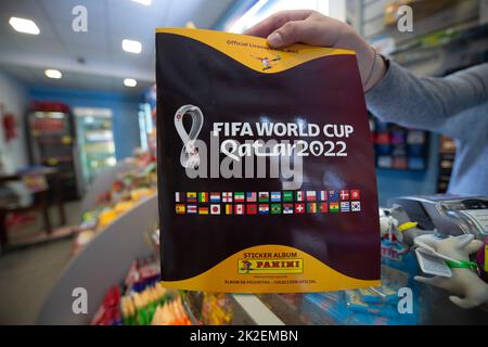 Buenos Aires, Argentina. 18th Sep, 2022. A saleswoman shows a Panini scrapbook ahead of the 2022 World Cup. Argentine kiosk sellers complained of a severe shortage of stickers for the album and demanded a solution from the Ministry of Commerce. Credit: Florencia Martin/dpa/Alamy Live News Stock Photo