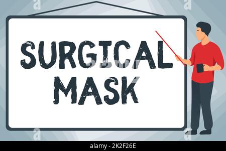 Affichage conceptuel masque chirurgical. Photo conceptuelle portée par les professionnels de la santé pendant la chirurgie et pendant l'école de soins infirmiers instructeur dessin pointage bâton tableau blanc tout en tenant la coupe. Banque D'Images