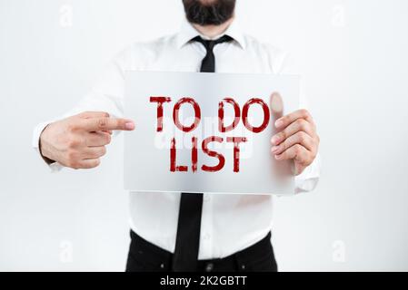 Liste des tâches à écrire. Mot écrit sur Une structure qui a généralement fait dans le papier continue tâche de la vôtre Banque D'Images