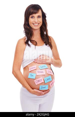 Whats in a name...A pregnant woman with post-it notes on her stomach with a selection of baby names. Stock Photo