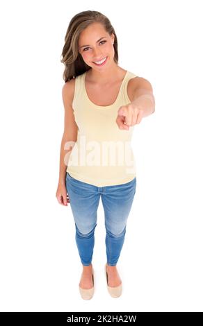 Shes got a casual confidence about her. High angle shot of a beautiful young woman pointing at you against a white background. Stock Photo