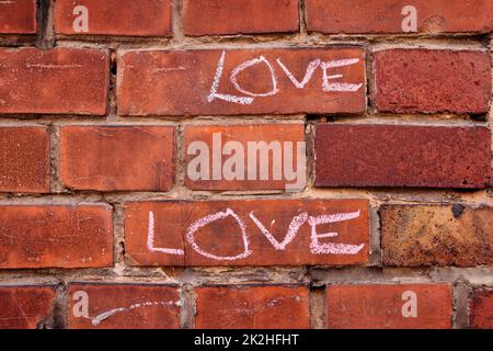 L'amour écrit sur un mur Banque D'Images