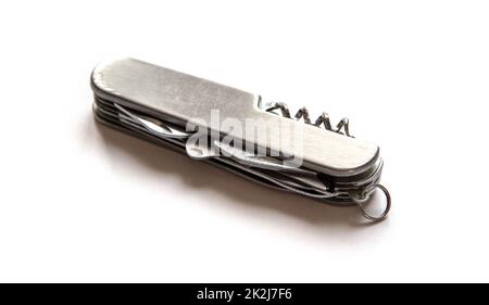 Couteau suisse métallique isolé sur blanc Banque D'Images