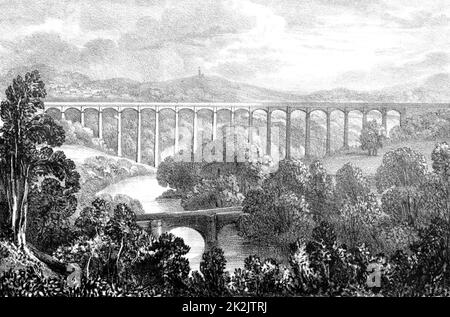 Aqueduc de Pont-y-Cysyllte sur le canal d'Ellesmere où il traverse la vallée de Llangollen, au pays de Galles. Le plus notable de tous les aqueducs à travers le fer en Grande-Bretagne. Construit par Thomas Telford (1757-1834), ingénieur civil écossais. Ouvert en 1805, il mesure 307 mètres de long, avec 19 arches et se trouve à 30,7 mètres au-dessus de la rivière Dee. Il coûte £47 018. Lithographie. Transport. Génie civil. Banque D'Images