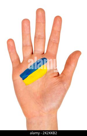 Main d'enfant avec un drapeau peint de l'Ukraine Banque D'Images