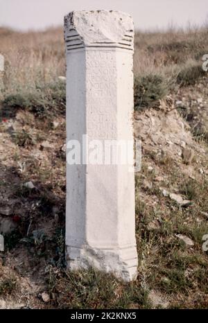 Pillar from the North Gate, excavations in progress at the archaeological site in  Stobi or Stoboi (in former Yugoslavia) - an ancient town of Greek Paeonia, later conquered by Macedon, and finally turned into the capital of the Roman province of Macedonia Salutaris. May 1980.  Archival scan from a slide. Stock Photo