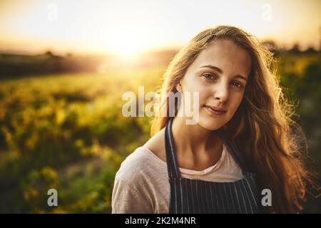 La vie agricole est pour moi.Portrait d'une jeune femme travaillant dans une ferme. Banque D'Images