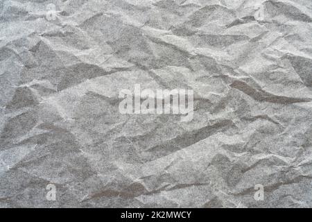 papier froissé sur une surface grise Banque D'Images