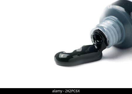 Gros plan d'un tube de peinture noire Banque D'Images