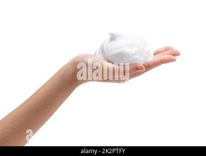 Main femelle avec bulles de savon sur fond blanc. Banque D'Images
