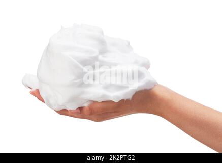 Main femelle avec bulles de savon sur fond blanc. Banque D'Images