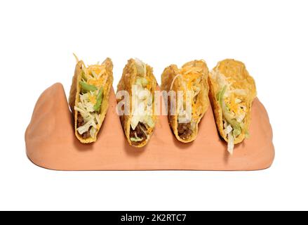Porte-gobelet en terre cuite avec quatre Tacos Crunchy Banque D'Images