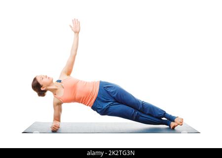 Woman doing yoga asana Vasisthasana - côté planche Banque D'Images