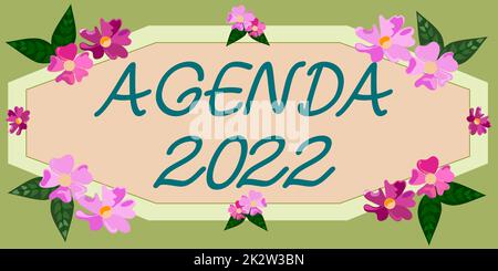 Panneau textuel montrant Agenda 2022. Concept signification liste d'activités dans l'ordre où elles doivent être prises cadre décoré avec des fleurs colorées et de feuillages arrangés harmonieusement. Banque D'Images