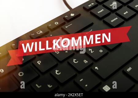 Texte d'écriture Willkommen. Vitrine d'affaires accueillant présenter un événement ou votre maison quelque chose à cet effet clavier d'ordinateur et Symbol.support d'information pour la communication. Banque D'Images